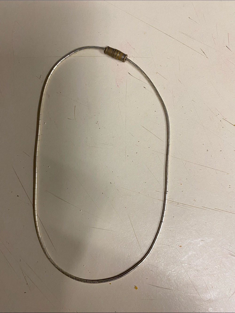 Silver Tone Tube Necklace with Gold Accent Clasp